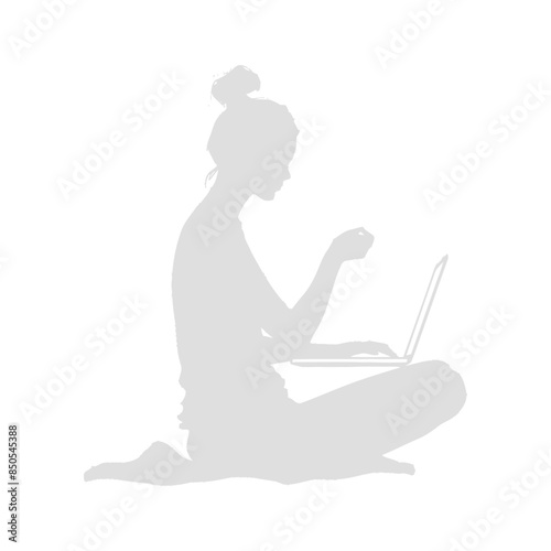 silhouette elderly woman playing on laptop while sitting cross legged