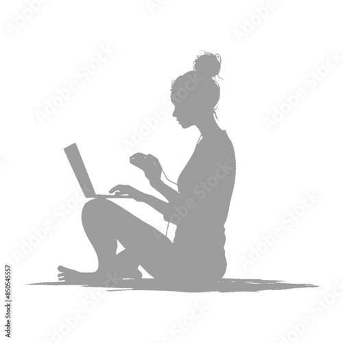 silhouette elderly woman playing on laptop while sitting cross legged