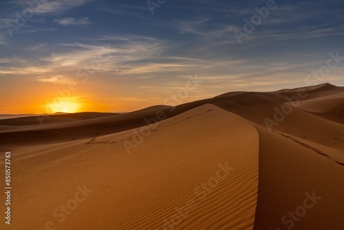 view of the sand dunes at Erg Chebbi in Morocco at sunset
