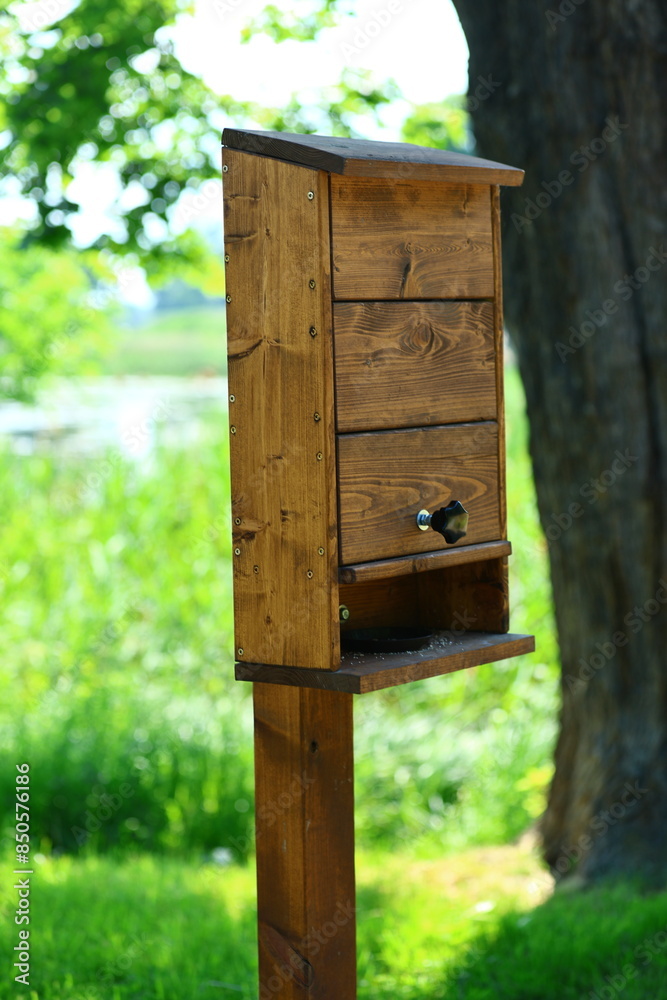 Wooden bird feeder in a park in the Lower Town of Gdansk Wooden bird feeder in a park in the Lower Town of Gdansk