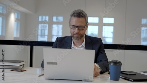 Wallpaper Mural Middle aged businessman working with laptop in office. Hispanic business man using laptop. Millennial man using laptop at office workplace. Ceo manager office worker business people working at office. Torontodigital.ca