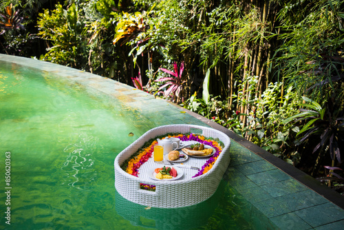 Beautiful view of  the breakfast in a swimming pool