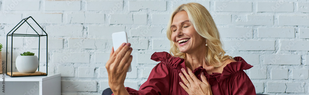 Fototapeta premium Elegant woman in stylish dress using cell phone.