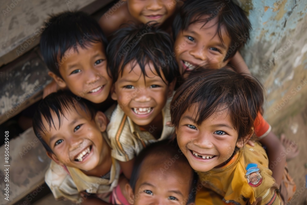 Group of happy asian children smiling and looking at camera at home