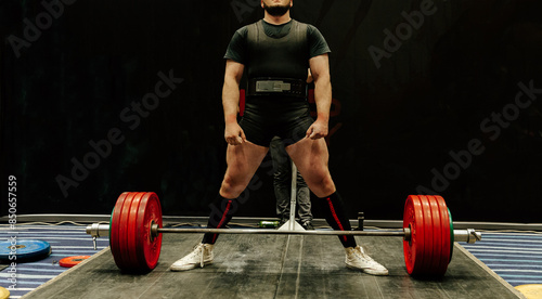 man athlete get ready deadlift at powerlifting competition photo