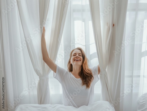 Free Download Happy young woman stretching in bed waking up alone happy concept, in cozy comfortable bedroom, enjoy good morning - GFXLoad