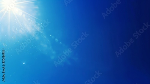 Clear sky background featuring a midday sun and a deep blue gradient
