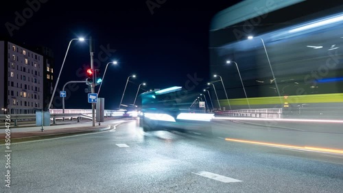 Night time lapse clip of cars and busses on Limfjordsbroen in Aalborg in Denmark photo