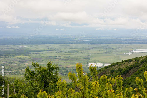 view of the Alazani valley in spring in cloudy weather. Sighnaghi, Georgia photo