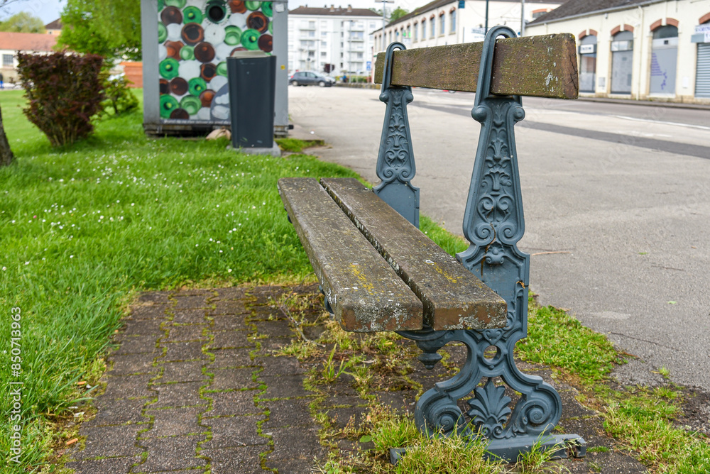 Old bench in a public park in france