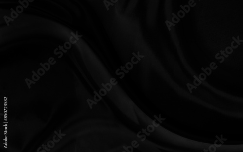 Black gray satin dark fabric texture luxurious shiny that is abstract silk cloth background with patterns soft waves blur beautiful.