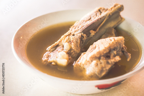 Slika na platnu Bak Kut The Pork Rib with 2 shorter pork ribs in a peppery soup