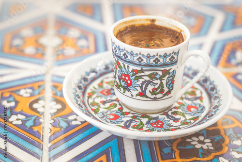 a cup of Lebanese coffee served in an ethnnic espresso cup photo