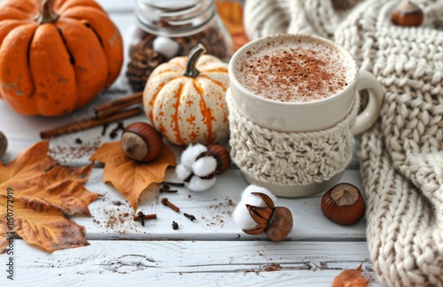 Cozy Autumn Still Life With Knitted Mug, Pumpkins, and Cinnamon