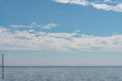 Fototapeta Naklejka Na Ścianę i Meble -  cloudy sky over the lake (boat)