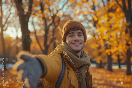 Friendly Man Inviting for Autumn Park Walk