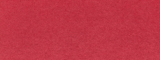 Texture of craft red paper background colors, macro. Structure of vintage kraft wine cardboard. Felt ruby backdrop