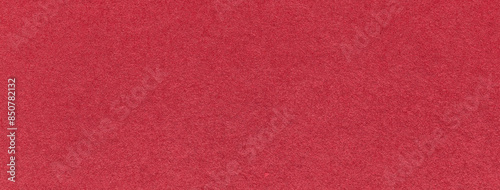 Texture of craft red paper background colors, macro. Structure of vintage kraft wine cardboard. Felt ruby backdrop