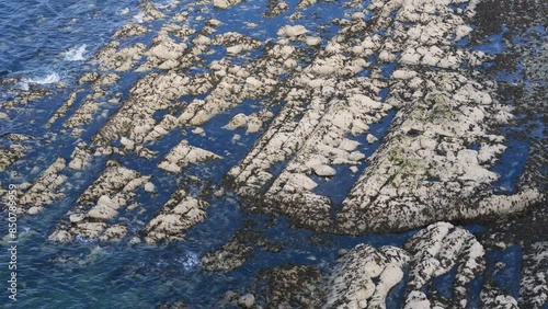 Ocean Drone Footage: Waves Crashing on Rocks with Seagulls Flying