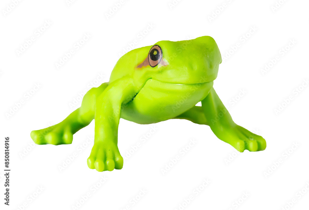 Naklejka premium Macro shot of a small green toy frog, front shot. Isolated on transparent background.
