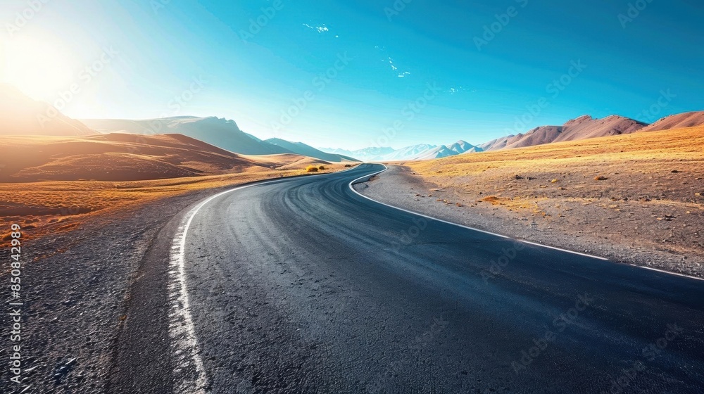 Empty asphalt road, winding through vast desert, clear blue sky, wideangle shot, bright sunlight, crisp details