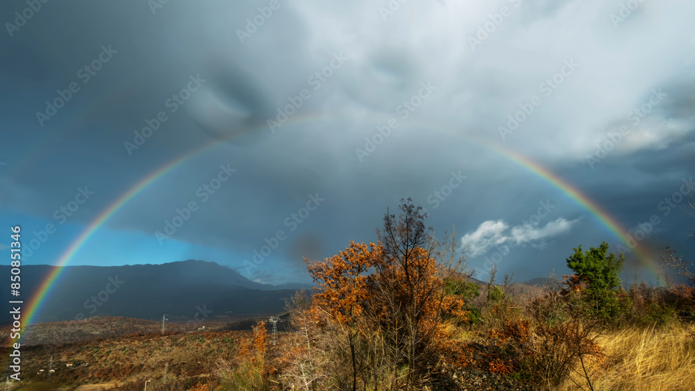 Landscape with rainbow in mountains Landscape with rainbow in mountains