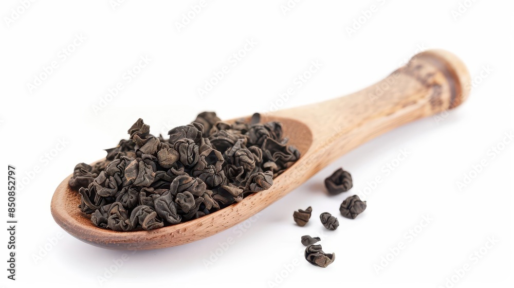 dry oolong tea leaves in wooden spoon camellia sinensis isolated on white background dry oolong tea leaves in wooden spoon camellia sinensis isolated on white background