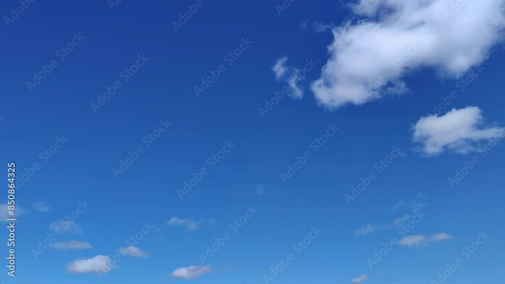 Little clouds moving in the sky at noon Little clouds moving in the sky at noon