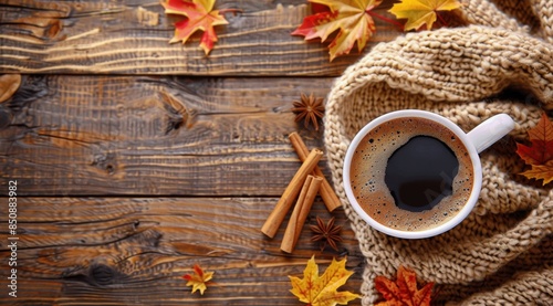 Cup of Coffee on Wooden Table With Fall Leaves and Cinnamon Sticks