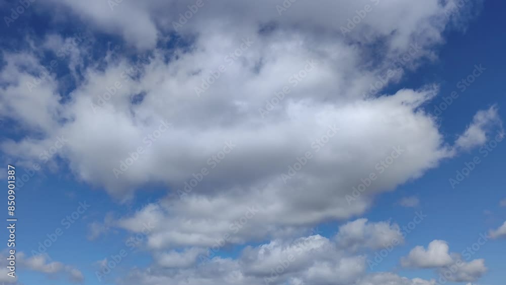 Curious flattened clouds moving at noon Curious flattened clouds moving at noon