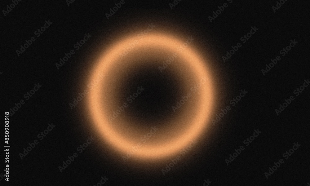 A blurry image of a circle with a dark background. The circle is orange and he is a sun A blurry image of a circle with a dark background. The circle is orange and he is a sun