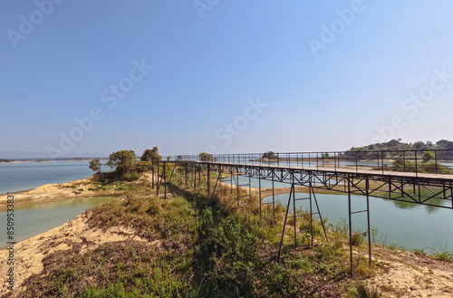 Wooden boardwalk in a remote island in Kaptai lake island resort photo