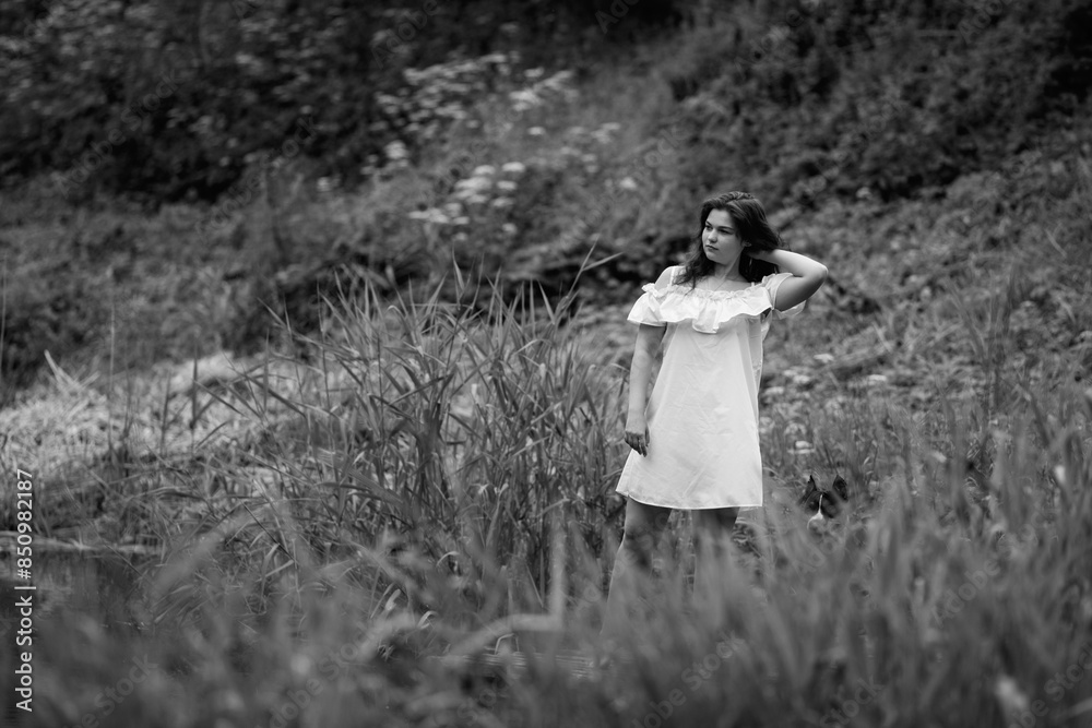 Portrait of a young beautiful dark-haired girl. Black and white photo. Portrait of a young beautiful dark-haired girl. Black and white photo.