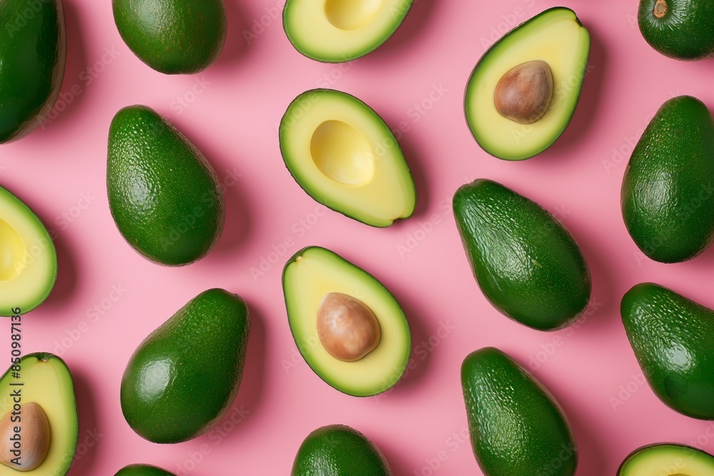 Fresh Avocado Halves and Whole Avocados on a Pink Background. Pattern of Whole and Sliced Avocados on Colorful Backdrop Fresh Avocado Halves and Whole Avocados on a Pink Background. Pattern of Whole and Sliced Avocados on Colorful Backdrop