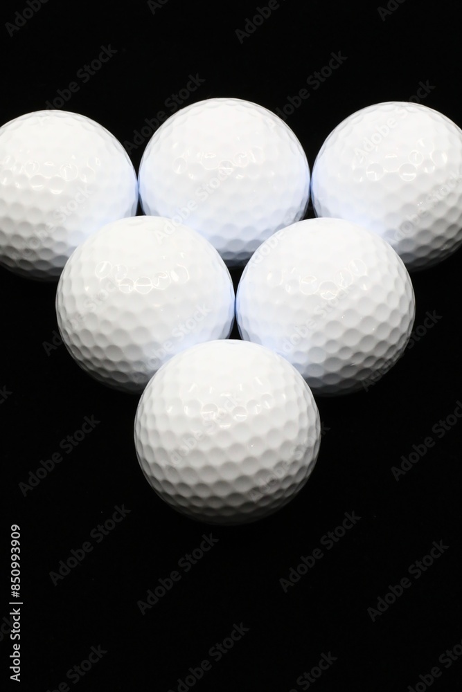 Golf balls on a black background Golf balls on a black background