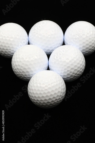 Golf balls on a black background  photo