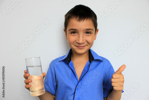 person holding a glass of water