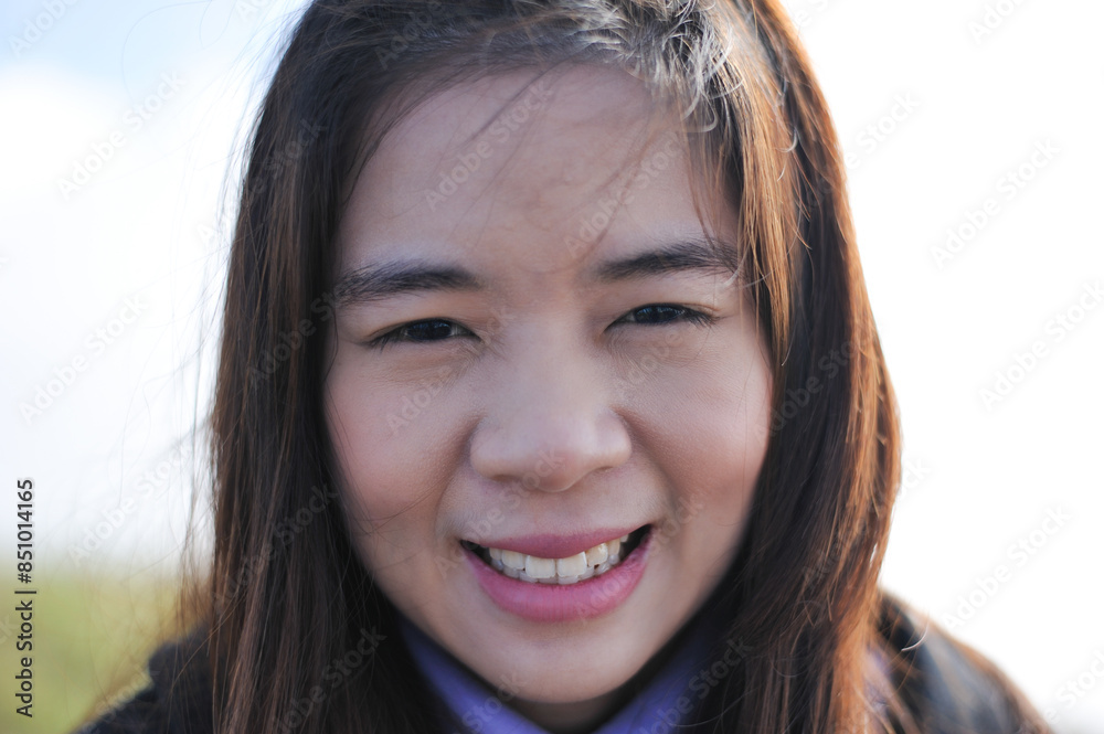 Close of portrait beautiful asian girl smiling at peak of mountain with nature Close of portrait beautiful asian girl smiling at peak of mountain with nature