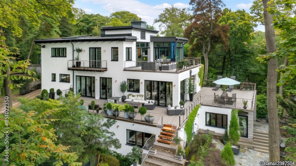 a modern country house with a wooden terrace, green lawn, white walls, and a gray roof, showcasing contemporary architecture. a modern country house with a wooden terrace, green lawn, white walls, and a gray roof, showcasing contemporary architecture.