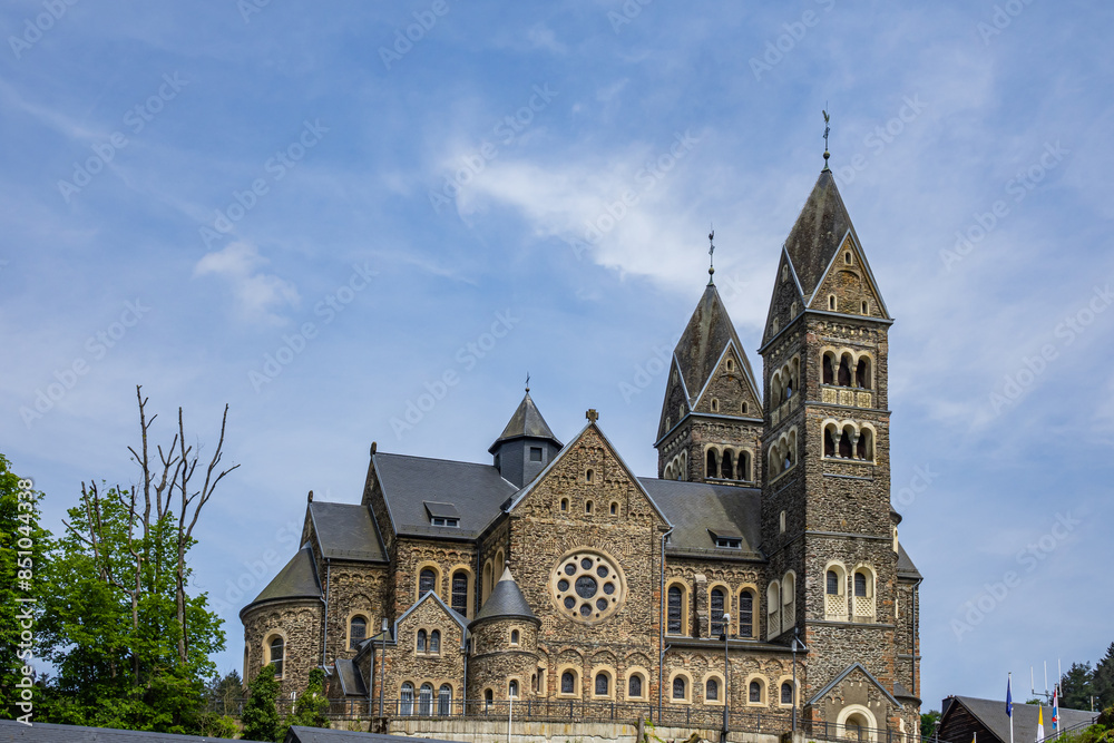View of Saints Cosmas and Damian Church (Eglise Saints-Come-et-Damien) with two spires. Clervaux, Luxembourg. View of Saints Cosmas and Damian Church (Eglise Saints-Come-et-Damien) with two spires. Clervaux, Luxembourg.