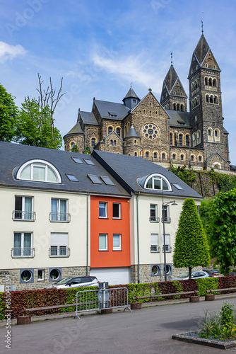 View of Saints Cosmas and Damian Church (Eglise Saints-Come-et-Damien) with two spires. Clervaux, Luxembourg. photo