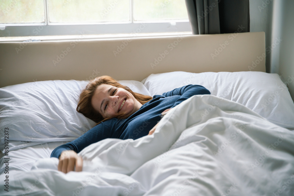 Morning joy of a woman relaxing in bed Morning joy of a woman relaxing in bed
