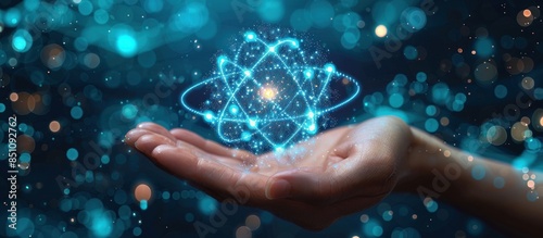A Hand Holding a Glowing Atomic Structure