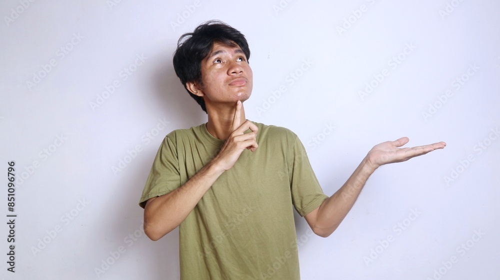 young asian man expression thinking something gesture and open hand side young asian man expression thinking something gesture and open hand side