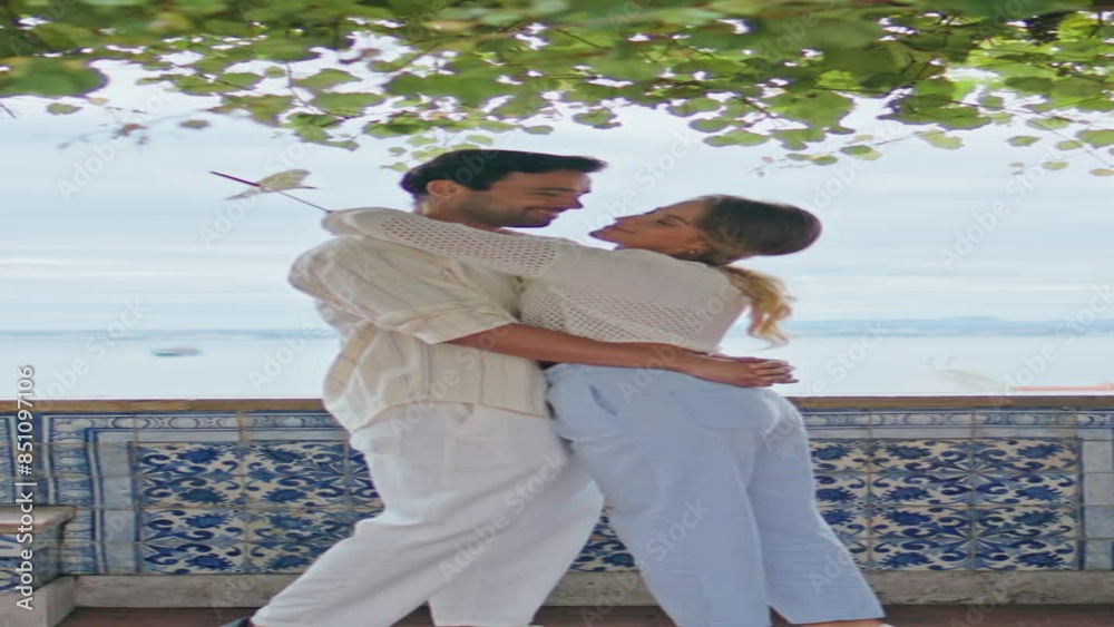 Happy couple kissing date on terrace vertical zoom on. Man woman embracing Happy couple kissing date on terrace vertical zoom on. Man woman embracing