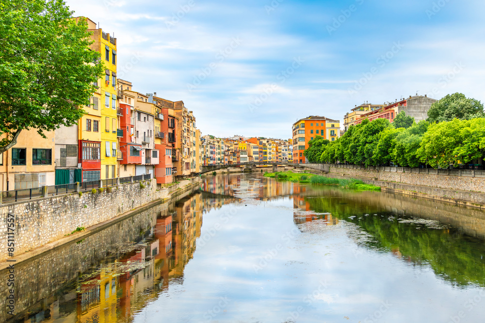 The colorful buildings lining the River Onyar at the historic town of Girona, Spain, near the Costa Brava coastline in the Catalonia region. The colorful buildings lining the River Onyar at the historic town of Girona, Spain, near the Costa Brava coastline in the Catalonia region.