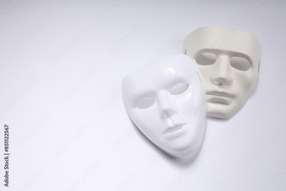 Theater arts. Two masks on white background, top view. Space for text Theater arts. Two masks on white background, top view. Space for text