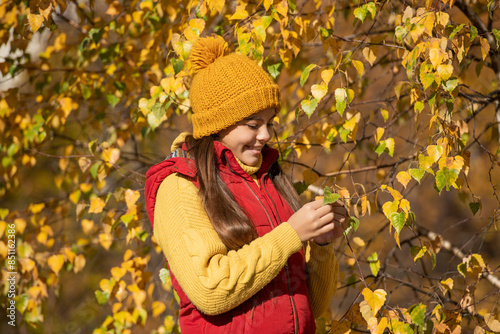 happy teen girl at school time outdoor with autumn leaves