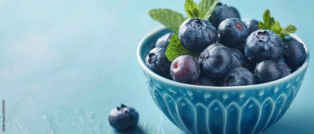 Fresh, ripe blueberries in a white bowl, emphasizing their vibrant color and wholesome appeal, perfect for culinary presentations and healthy eating habits Fresh, ripe blueberries in a white bowl, emphasizing their vibrant color and wholesome appeal, perfect for culinary presentations and healthy eating habits