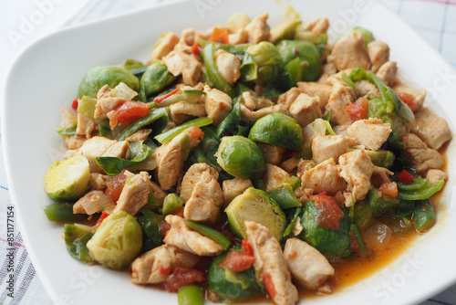 Enjoy a nutritious StirFry Brussel Sprouts with Chicken and Vegetables for a wellrounded meal photo